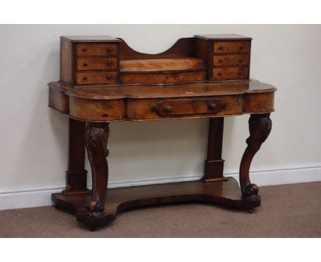 Late Victorian figured walnut serpentine Duchess dressing table fitted with single drawer, six trinket drawers, hinged centre