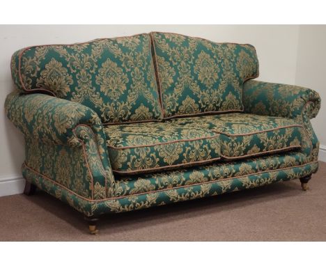 Late 20th century traditional shaped two seat sofa upholstered in green and gold damask fabric, raised on turned front feet f