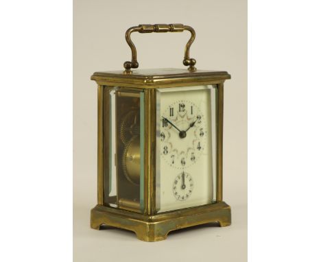 20th century bevel glass panelled and brass alarm carriage clock, French movement, striking on a bell, enamel dial signed 'Wo