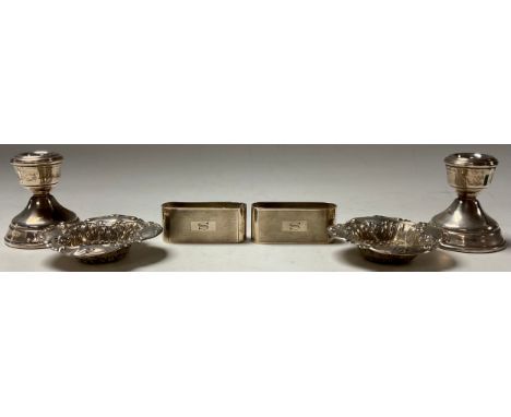 A pair of Victorian silver shaped square trinket dishes, embossed throughout with scrolls, 8.5cm wide, Sheffield 1899, 41.6g;