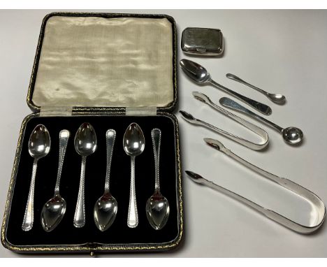 A pair of George III silver sugar bows, Newcastle; two GIII bright cut spoons; a set of six silver teaspoons; a small Victori