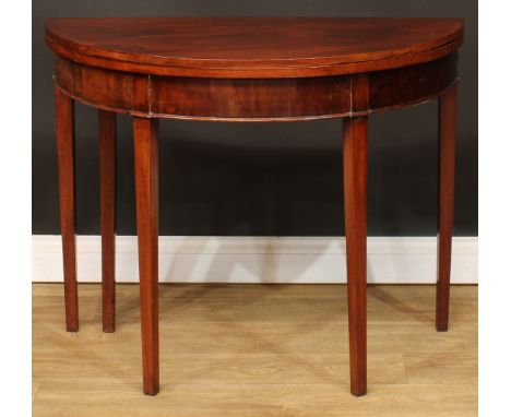 A George III mahogany demilune card table, folding top, tapered square legs, 73cm high, 92cm wide, 45cm deep