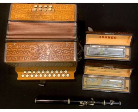A Hohner piano accordeon (sic), Marca Germany; two Hohner 64 chromonica, boxed; another; a flute (4) 