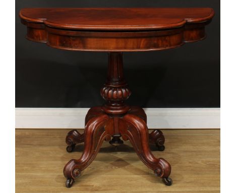 A Victorian mahogany card table, hinged top enclosing a baize lined playing surface, fluted column, cabriole legs, scroll fee