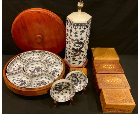 A Chinese export ware hexagonal lamp base, printed and painted with dragons, picked out in gilt; a similar treen lazy Susan w