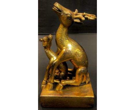 A Chinese gilt metal two piece seal as a stag with fawn, 19cm high, 20th century 