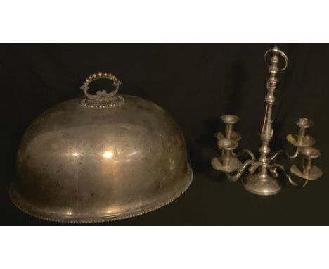 A large 19th century plated meat dome, 47cm wide, c.1880;  a four light table candleabrum (2) 