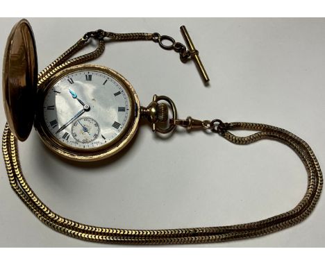 A gold plated hunter pocket watch, Fortune Gold Filled, AWC Co. Canada, the engraved case with vacant shield cartouche, white