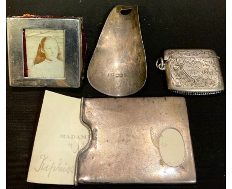 Silver - an Edwardian visiting card case, Birmingham 1904; a miniature photograph frame, Birmingham 1902; a shoe horn, Sheffi