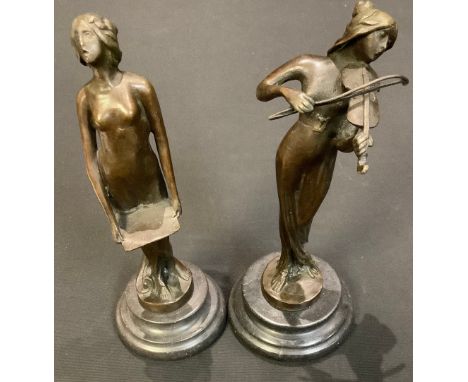 A near pair of dark patinated bronzed figures, of a lady playing a violin, her companion holding a tray, each approx 18.5cm h