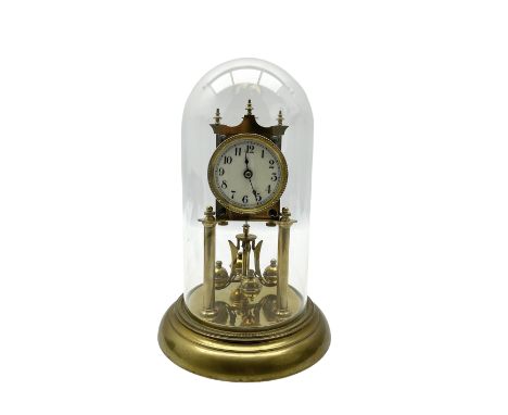 Continental- early-20th century torsion clock under a glass dome, movement raised on two pillars on a circular brass base, wi