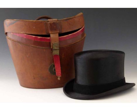 Antique brown leather top hat case together with a black dressage top hat by Herbert Johnson, circa 1990 Condition report: se