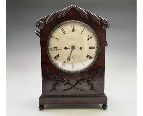 A William IV mahogany bracket clock, the dial signed Saunders, Dorchester, with twin fusee movement, the case with swept foli