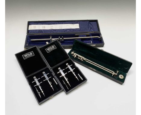 A cased planimeter, with Vernier adjustment, total length 44cm, a similar smaller planimeter, and two cased sets of Wild Heer