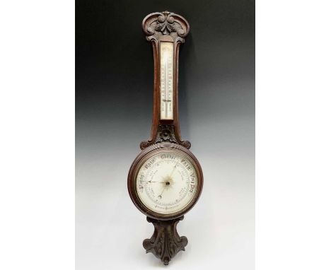 A late Victorian oak wheel barometer. Height 85cm.