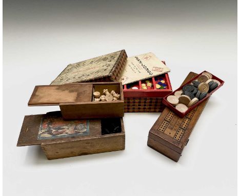 A late Victorian mahogany games box, the cover inlaid for cribbage and containing dominoes and draughts, length 28.5cm, a mah