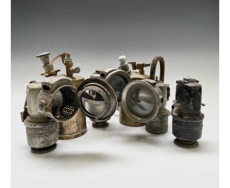 A P&amp;H acetylene motorcycle lamp, height 18cm, together with three other lamps and a pair of brass sprayers (6).