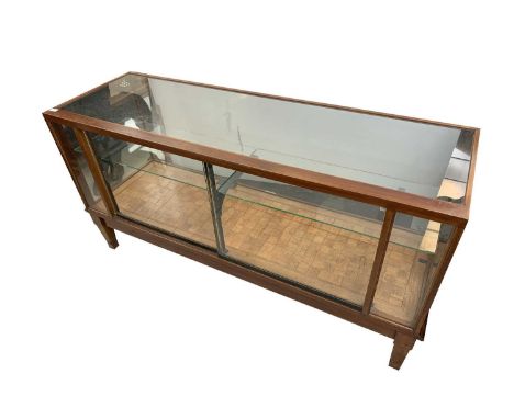 A walnut and oak glazed haberdashery or shop display cabinet, mid 20th century, with retailers label for Harris &amp; Sheldon