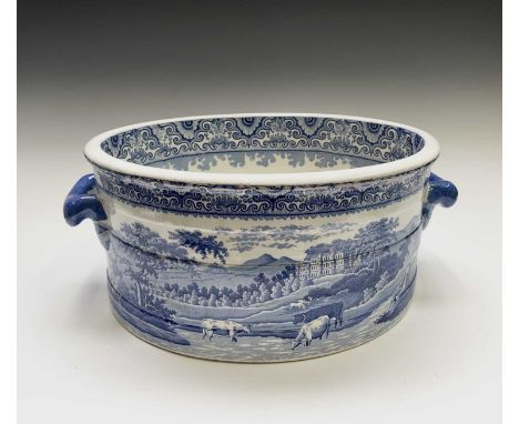 A large pearlware footbath, stamped Heathcote &amp; Co, circa 1820, of oval banded section with twin handles and transfer pri
