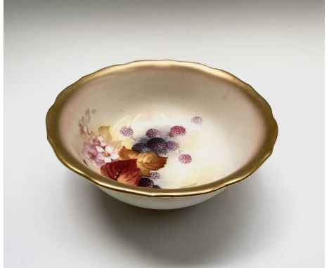 A Royal Worcester bowl, painted with autumnal foliage and berries etc, signed K Blake (Kitty Blake), printed marks and date c