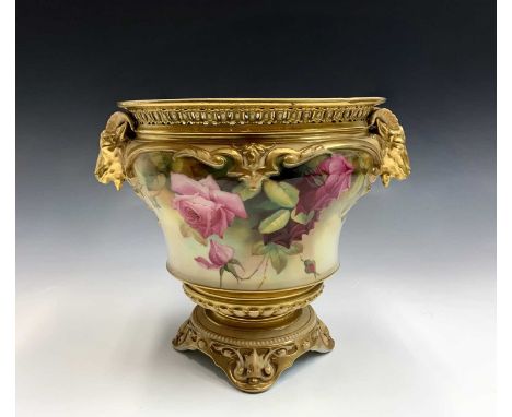 A Royal Worcester blush ivory floral decorated and gilt jardiniere, circa 1900, with goat mask handles, painted with full blo