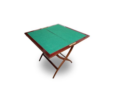 A mahogany folding coaching table, circa 1900, with a baize lined top, labelled 'Finnigans LD. Manchester &amp; Liverpool', f