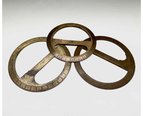 A surveyors brass protractor, stamped Hall Harding Ltd, London, diameter 23cm, another of a similar size and one other (3).Fr