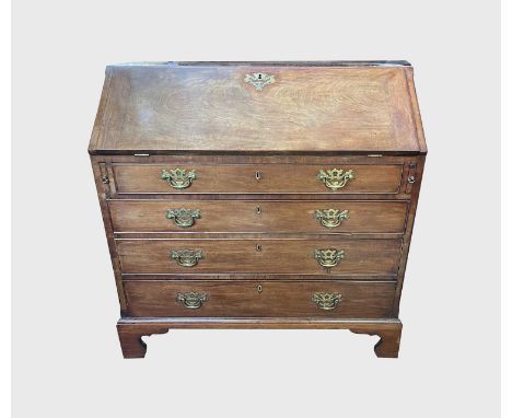 A George III mahogany bureau, the fall front openiong to reveal a fitted interior, above four long graduated drawers, on brac