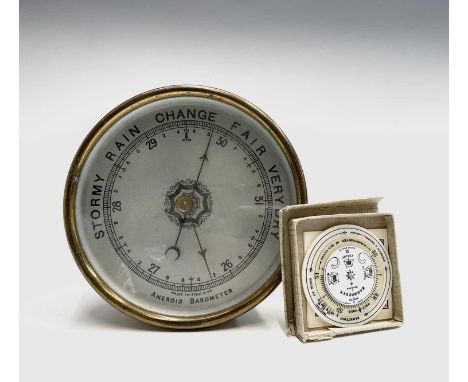 A Negretti &amp; Zambra pocket weather forecaster, with ivorine dials, diameter 5.2cm, boxed with instruction leaflet, togeth