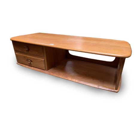 An Ercol light elm Minerva long rectangular coffee table, fitted with two drawers, height 39cm, width 125cm, depth 53.5cm.Con