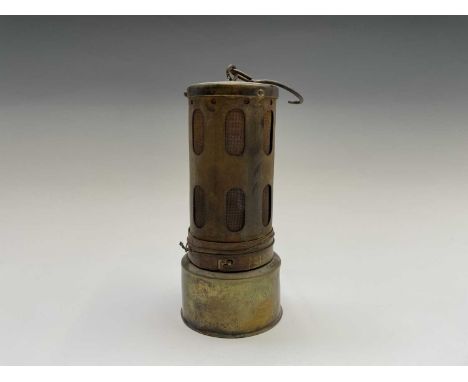 A small brass and steel miners lamp, with makers stamp W&amp;P B, patent No 23573109, height 15cm, together with a brass heat