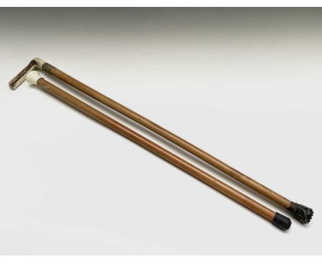 A silver mounted malacca and horn walking stick, engraved 'A C Gee Redruth', together with one other cane (2).