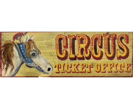 A wooden sign, 'CIRCUS TICKET OFFICE', hand painted with text and the image of a circus horse. 44.5 x 129.5cm. 