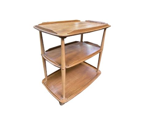 An Ercol light elm three tier trolley, with turned beech supports on castors. Height 75cm, width 71cm, depth 47cm.
