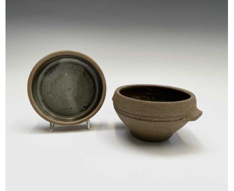 Two pieces of Leach Pottery Standard Ware comprising a twin handled bowl, height 7cm, width 14cm, and a circular dish, 11.5cm