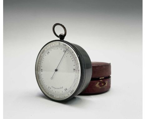 A late Victorian compensated travel barometer, in gunmetal case, with silvered dial, diameter 7.5cm, in leather case.