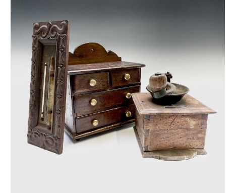 A late 19th century mahogany miniature chest, of two short and two long drawers, width 26cm, together with a coffee grinder a