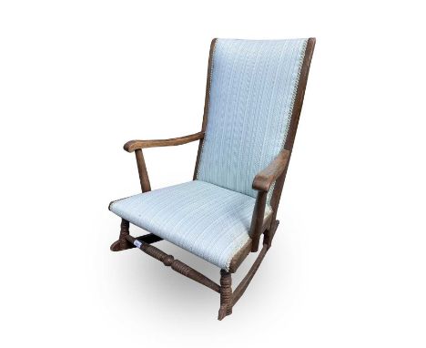 A beech framed rocking chair on ring-turned front legs. Height 89cm.