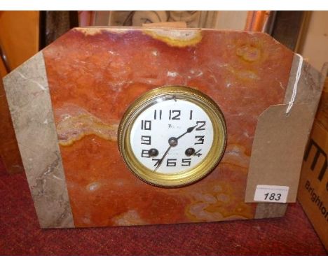 An Art Deco marble mantel clock, Arabic enamel dial, spade hands, drum movement, striking bell 