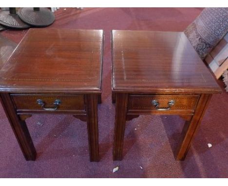 A Georgian style mahogany coffee table, with two drawers, together with a pair of matching lamp tables 