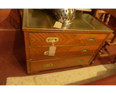 A 20th century Campaign mahogany chest, brass bound, with leather top, three drawers, raised on bracket feet, H.63 W.89 D.48c