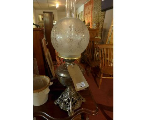 A Victorian oil lamp with glass shade 