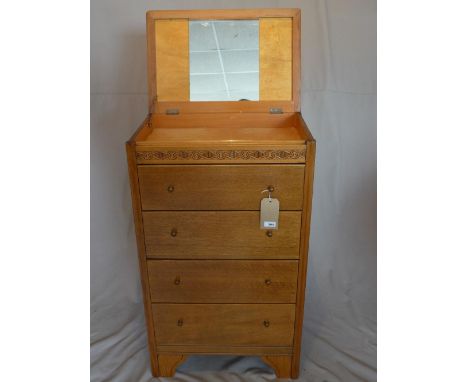 An early 20th century oak pedestal dressing chest, with mirrored back hinged lid, above five drawers, raised on bracket feet,