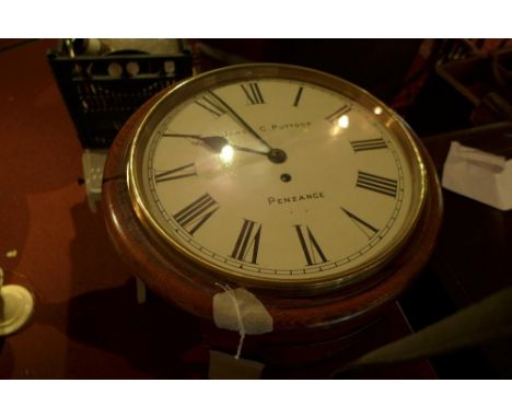 An early 20th century oak round dial wall clock, the 12" painted Roman dial signed James C. Puttock, Penzance, single fusee m
