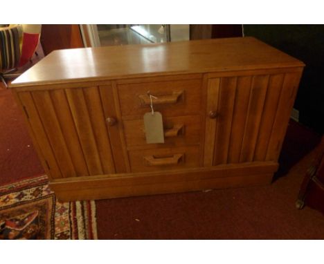 An early 20th century light oak low cabinet, with two drawers, two linen fold doors, raised on plinth base, H.54 W.92 D.44cm 