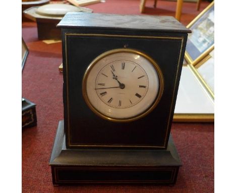 A 19th century French ebonised mantel clock, Roman enamel dial signed 'Escort, Neuvic', the ebonised case with brass mount to