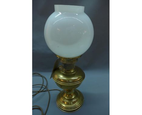 A 20th century brass oil lamp, by Aladdin, converted to electricity 