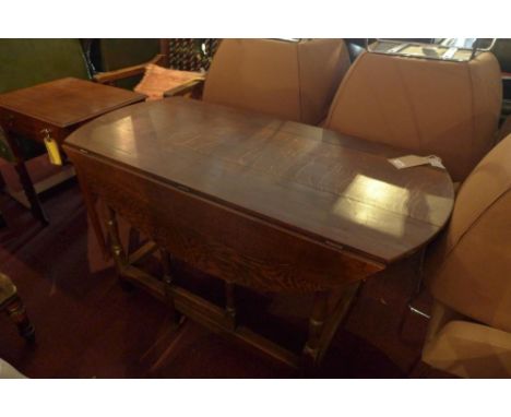 An early 20th century oak gate leg table 