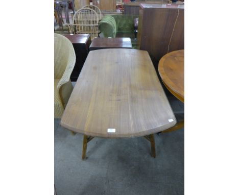 An Ercol drop-leaf dining table