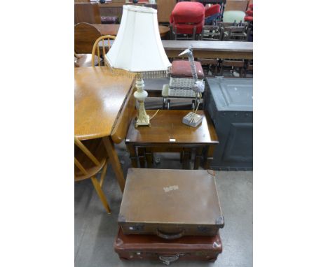 A nest of tables, two cases, a folding step stool, sewing box, a table lamp and a figural heron
